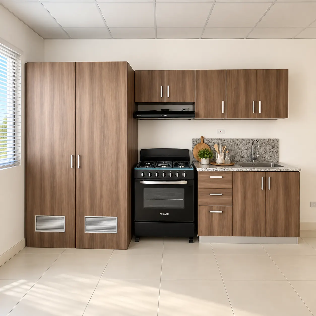 Cocina con gabinetes y estufa en casa modelo Palma